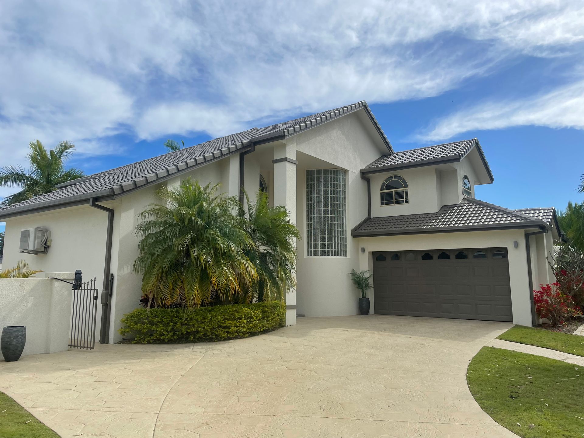 New roof tiles double story house— Roofer in Southport QLD