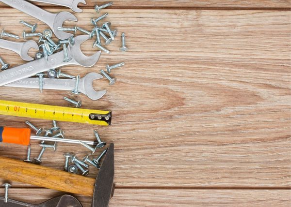 Handymen Saskatoon tools resting on laminate flooring