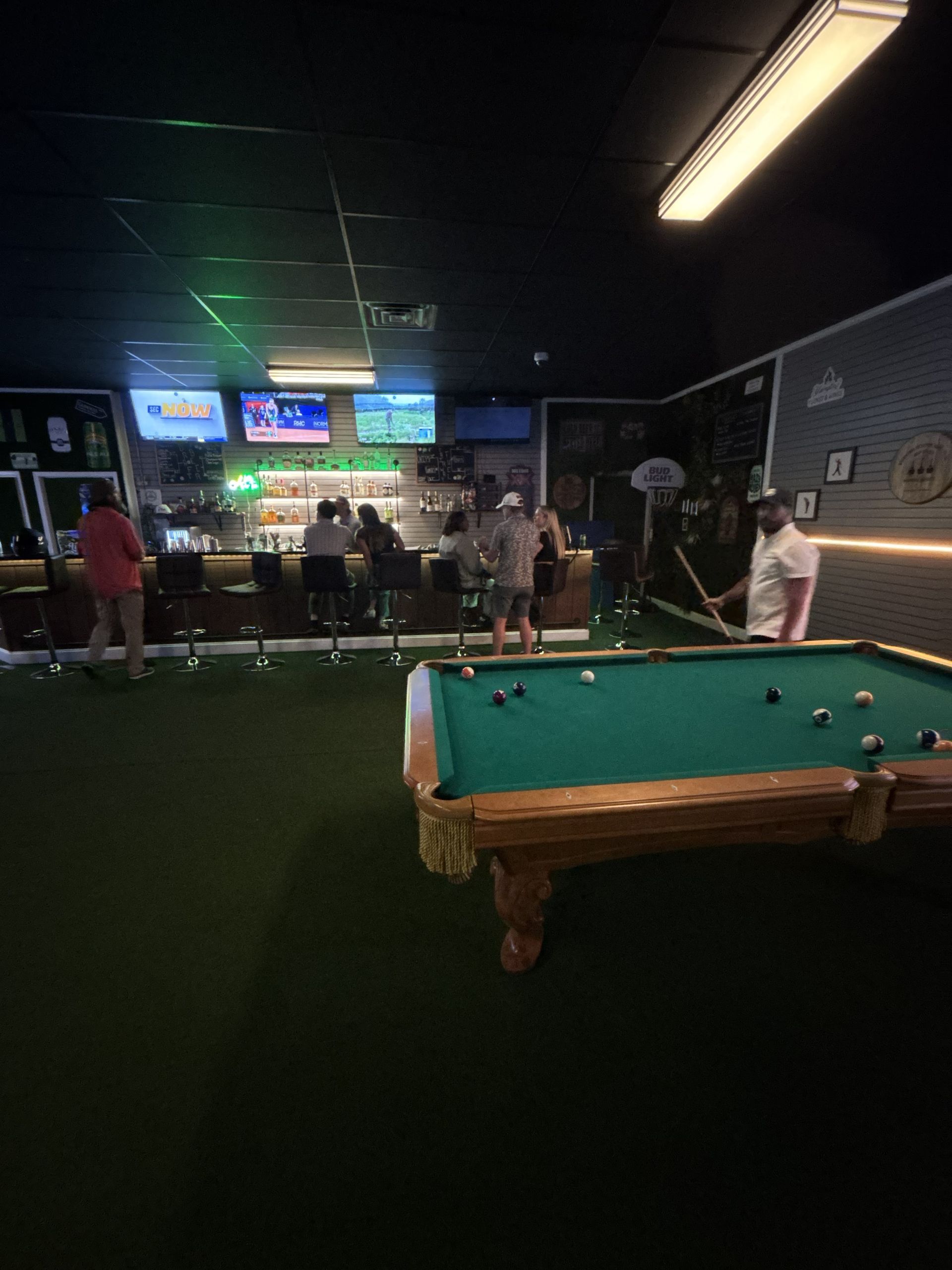 full bar with golf simulators
