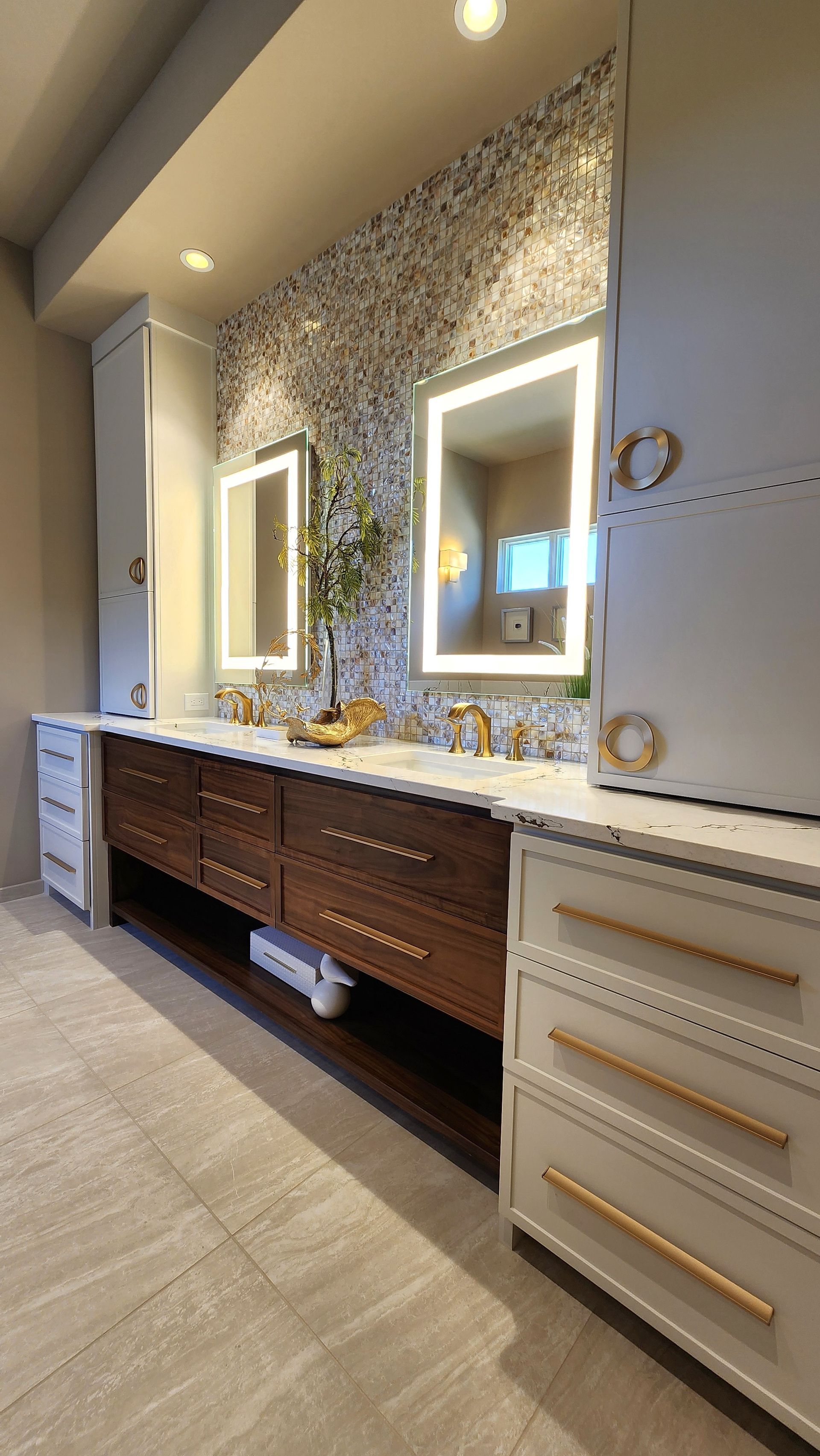 A bathroom with two sinks and two mirrors.