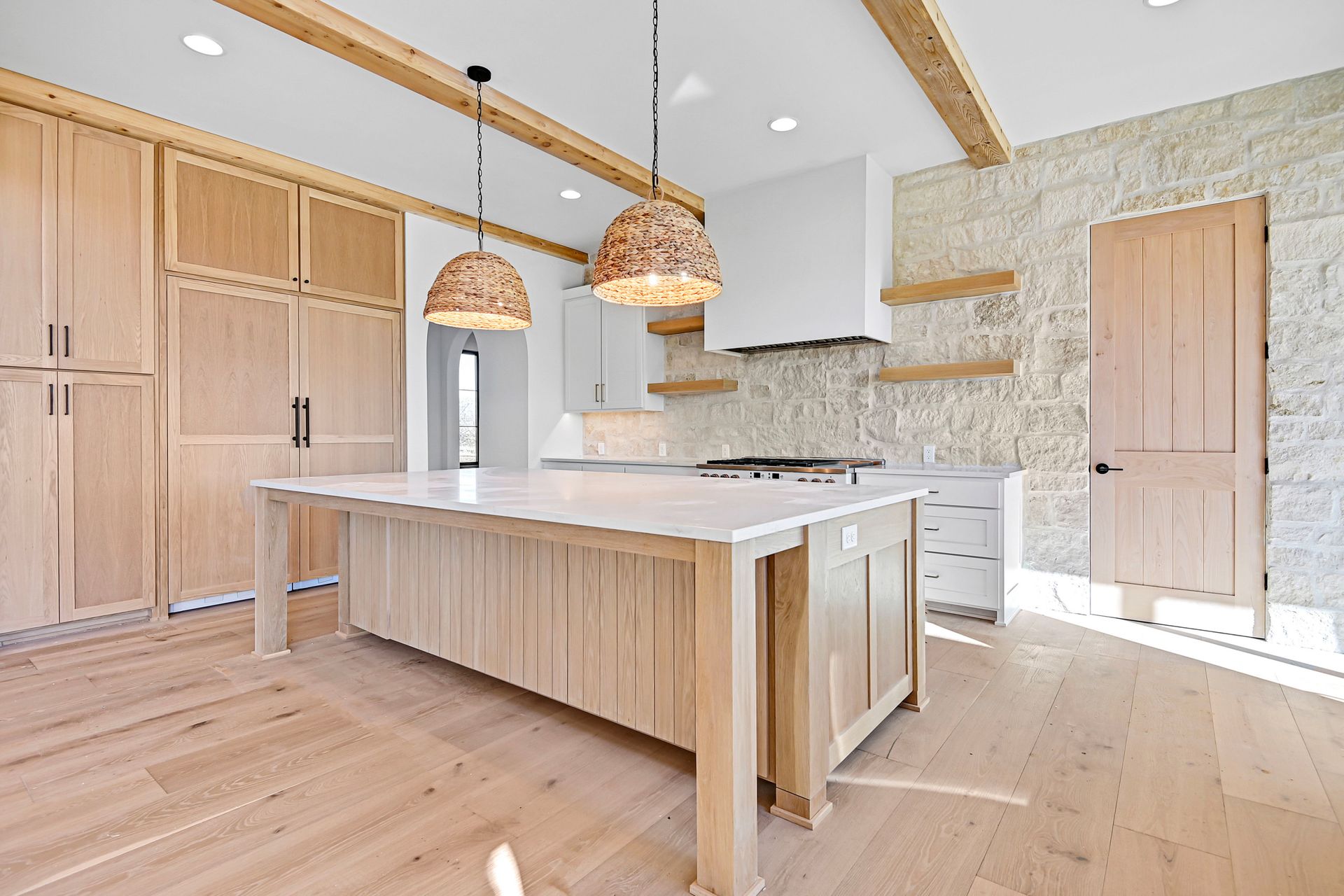 There is a large island in the middle of the kitchen.