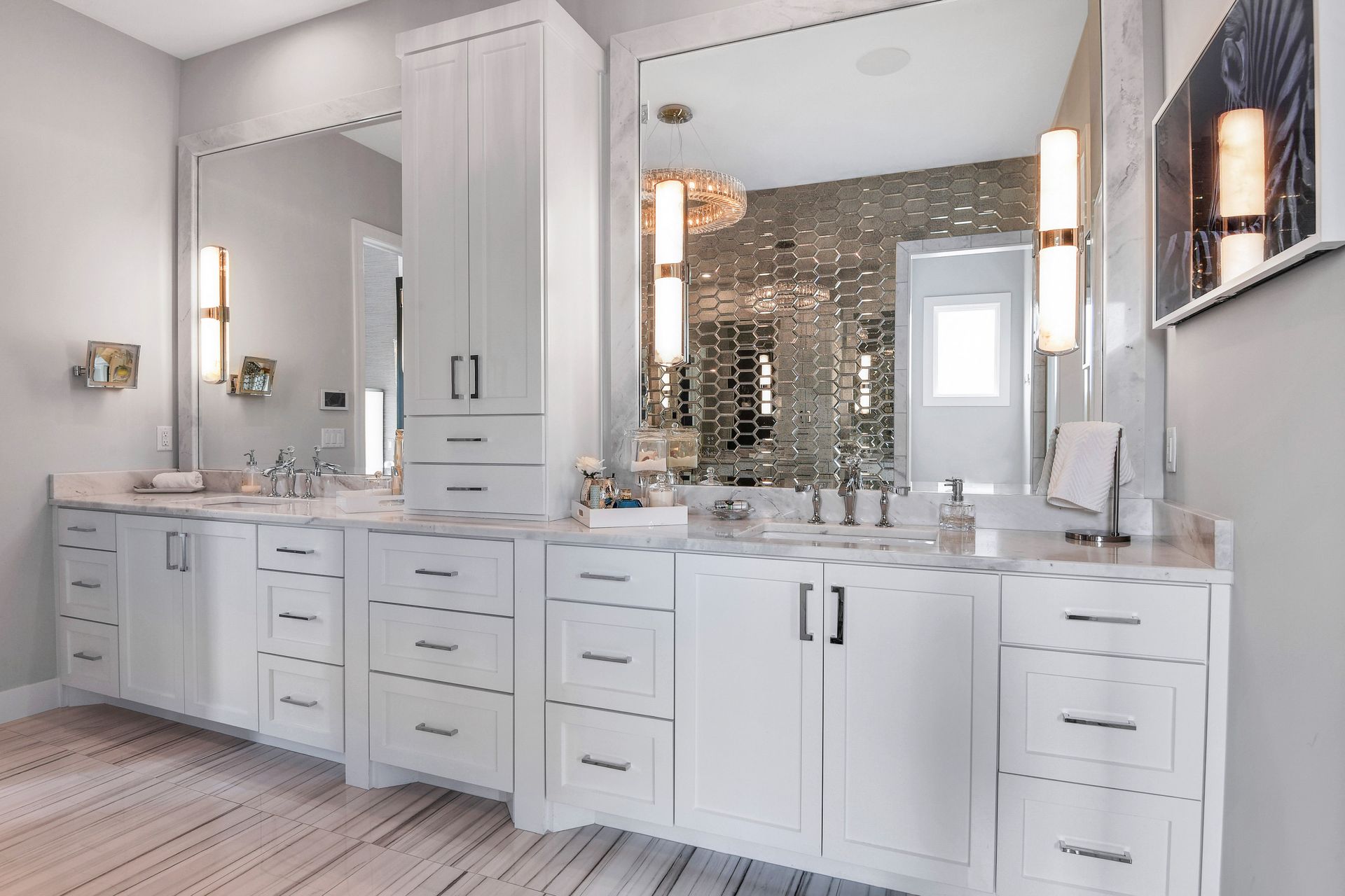A bathroom with two sinks and a large mirror.