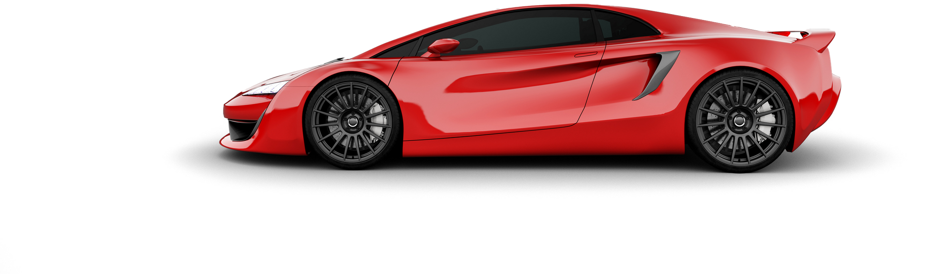 A red sports car is sitting on a white surface.