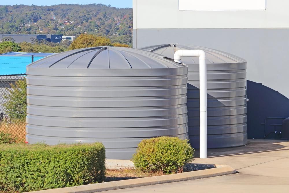 Two Large Gray Water Storage Tanks — Gin Gin Domestic Water Supplies in Wallaville, QLD