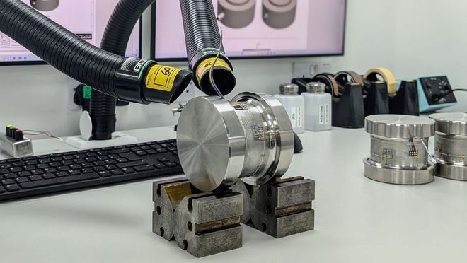 A load cell being manufactured and strain gauged.