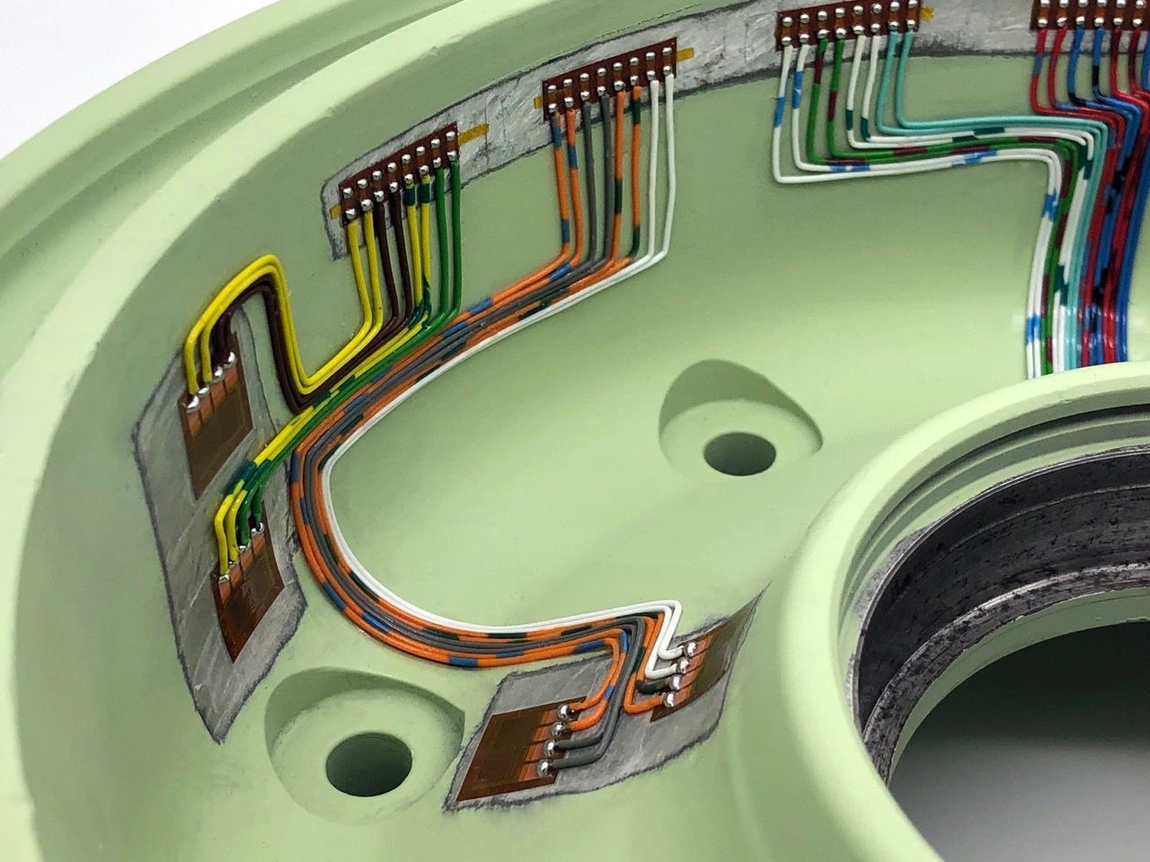 medium close up of strain gauging within a wheel hub