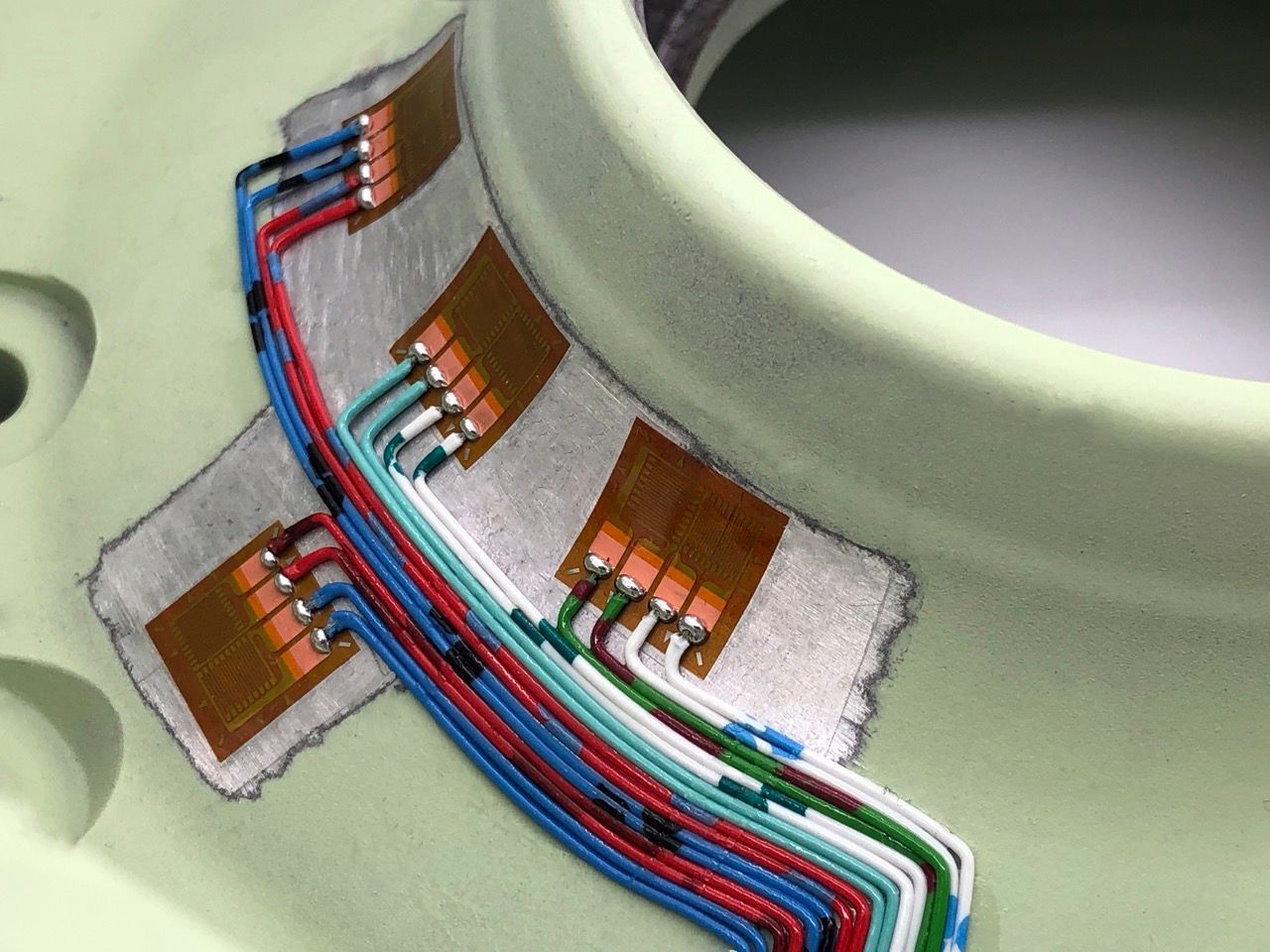 strain gauges and neat wiring within a wheel hub
