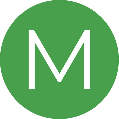The letter M inside a green circle
