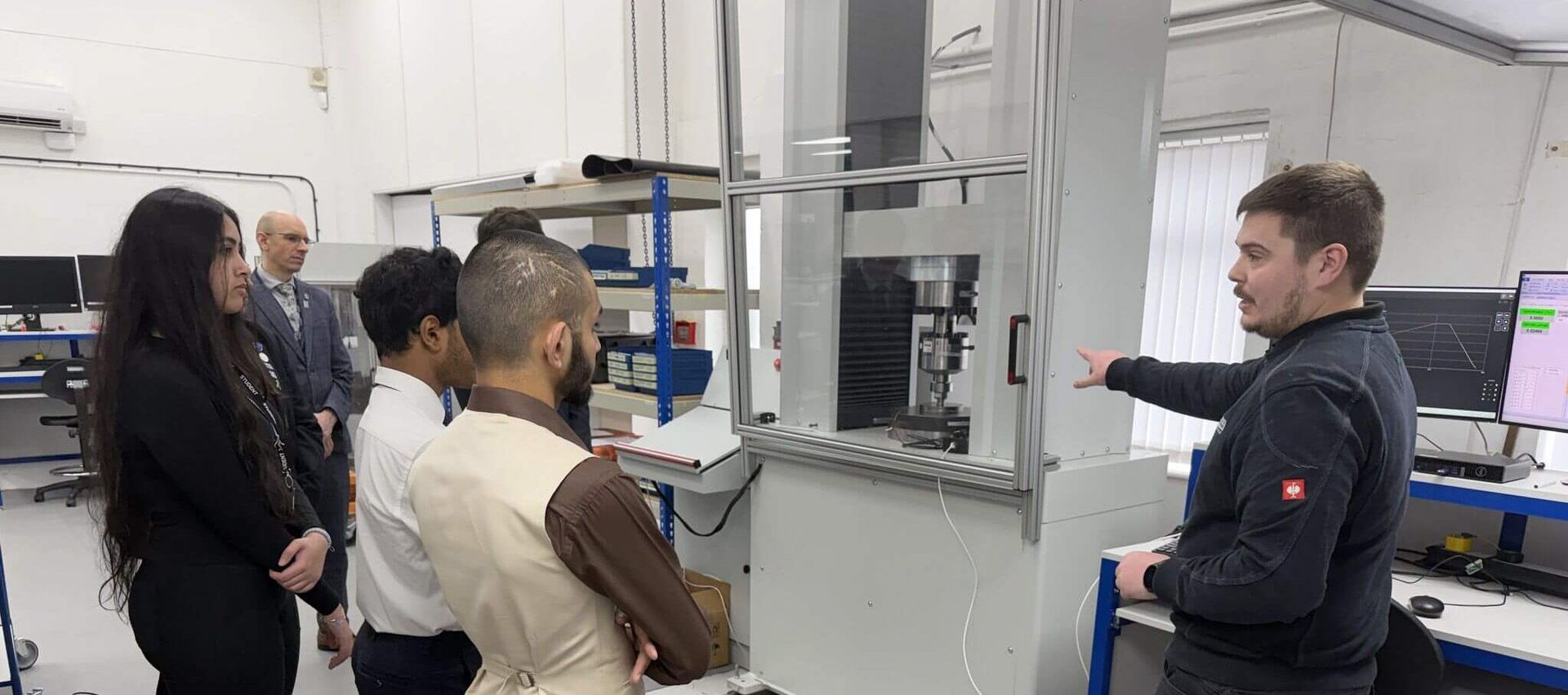 Calibration technician from Procter & Chester showing students from WMG Academy the load cell calibration procedure.