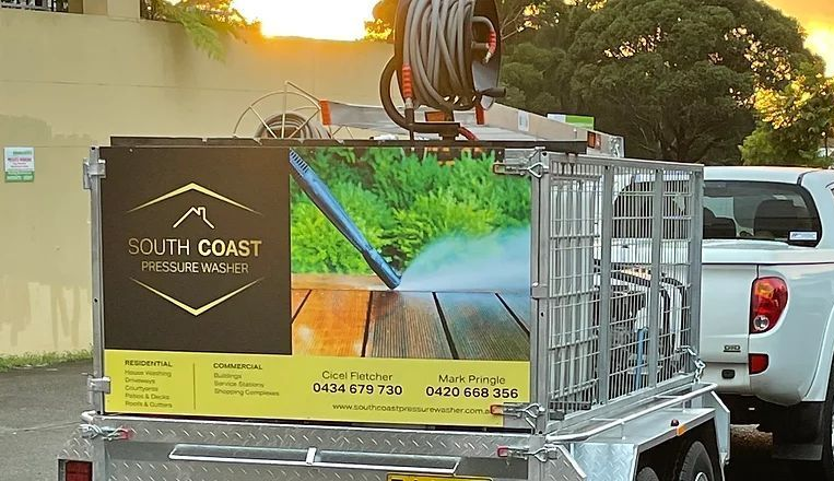 A White Pickup Truck Pulling a Trailer — South Coast Pressure Washer in Warilla, NSW