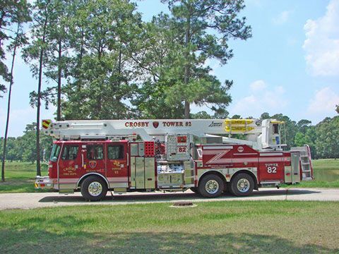 A red and white fire truck with the number 87 on it