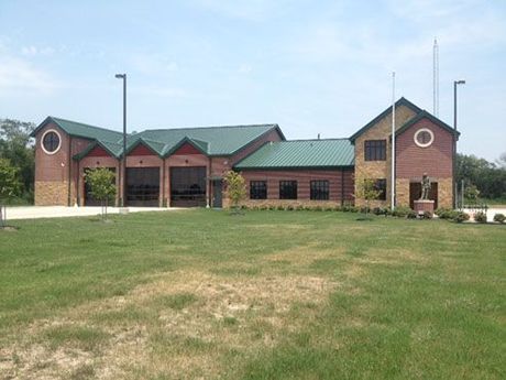 A picture of a Crosby VFD fire station with a green roof.