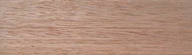 Close-up of a wood grain pattern. The wood has a reddish-brown color with visible grain lines.
