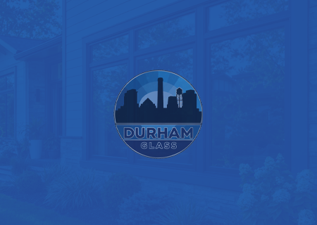 Durham Glass logo over blue-tinted storefront windows