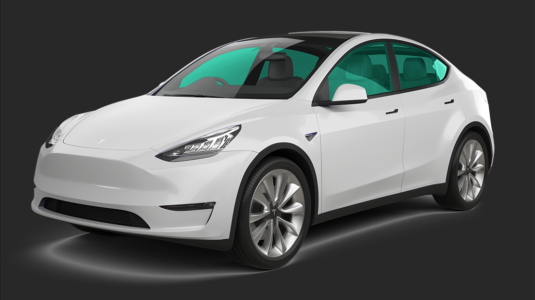 A white tesla model s is sitting on a white surface.