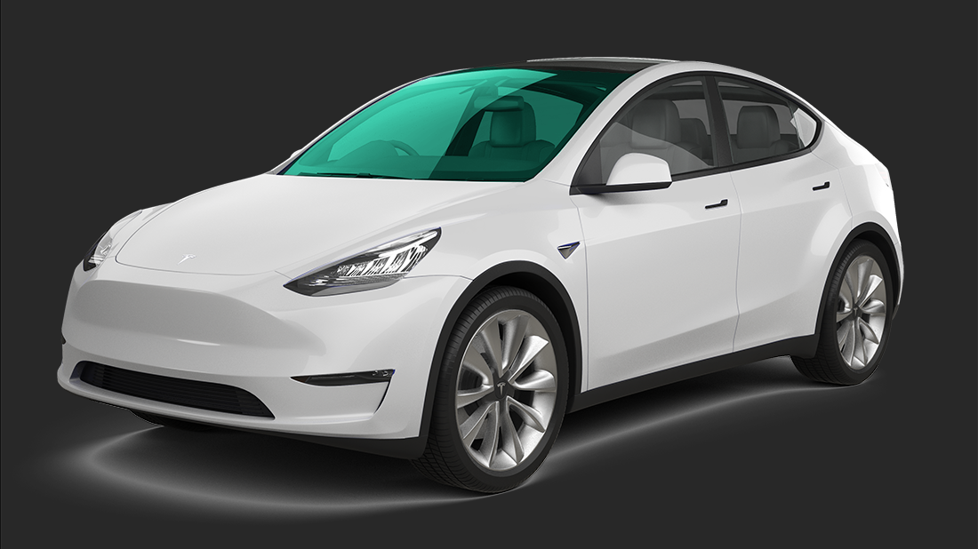 A white tesla model s is sitting on a white surface.