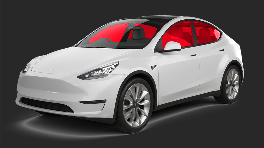 A white tesla model s is sitting on a white surface.