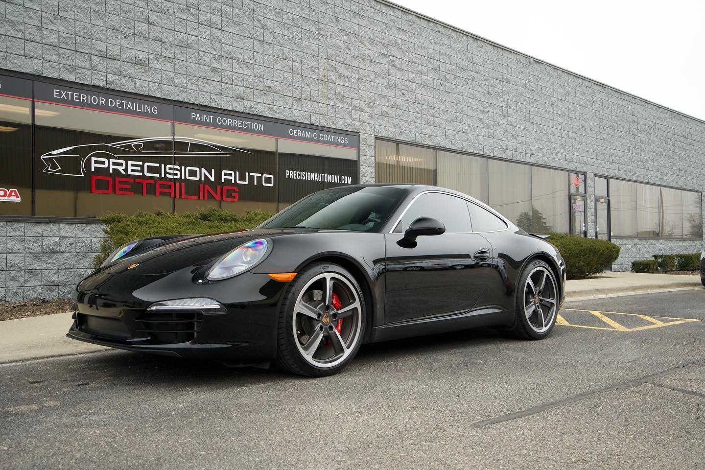Luxury vehicle treated with ceramic coating in Novi for superior sun protection, maintaining glossy paint and preserving interior finishes.