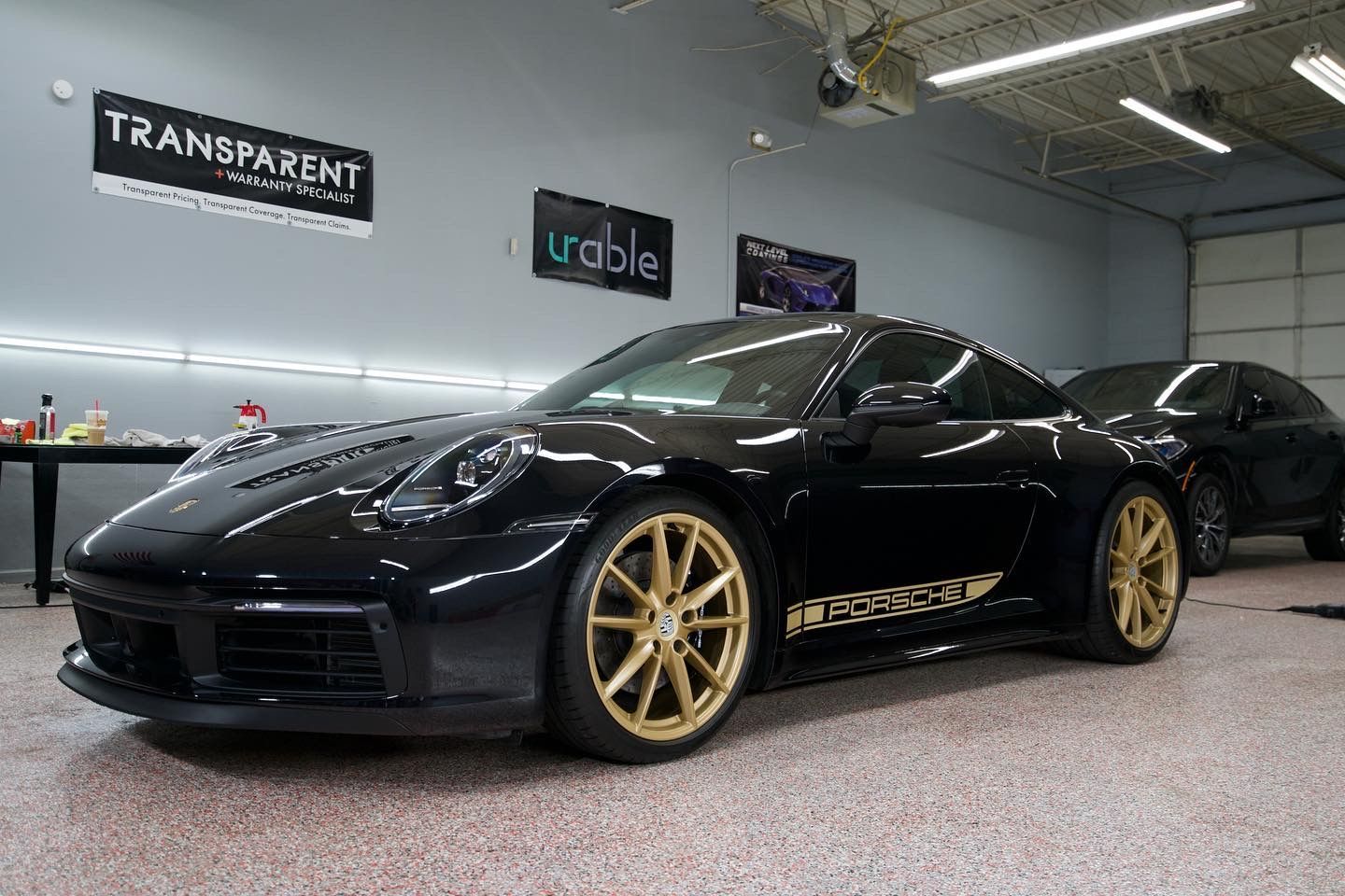 Luxury vehicle treated with ceramic coating in Novi for superior sun protection, maintaining glossy paint and preserving interior finishes.