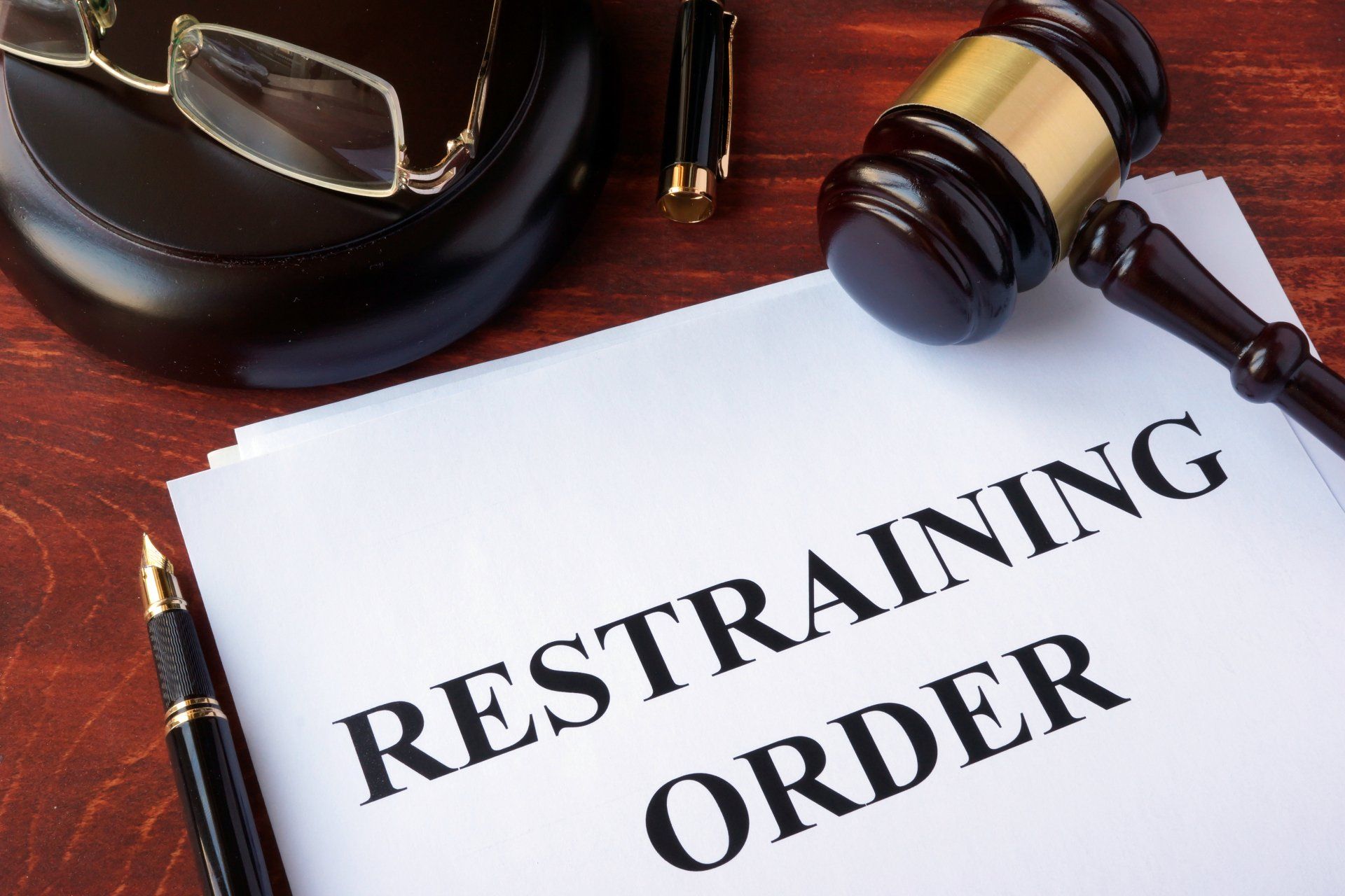 A piece of paper that says restraining order on it