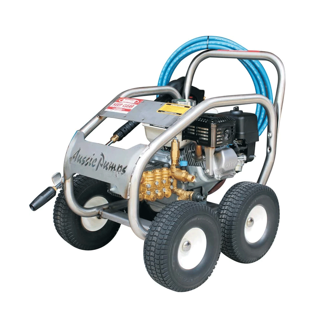 Portable four-wheeled pressure washer with silver frame, black engine, and blue hose on a white background