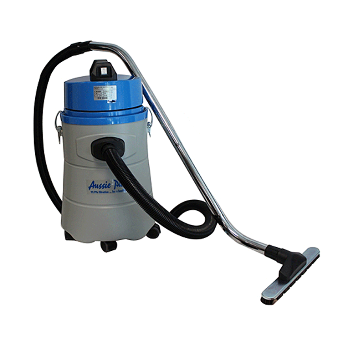 Blue and gray canister vacuum with hose and floor nozzle on a white background