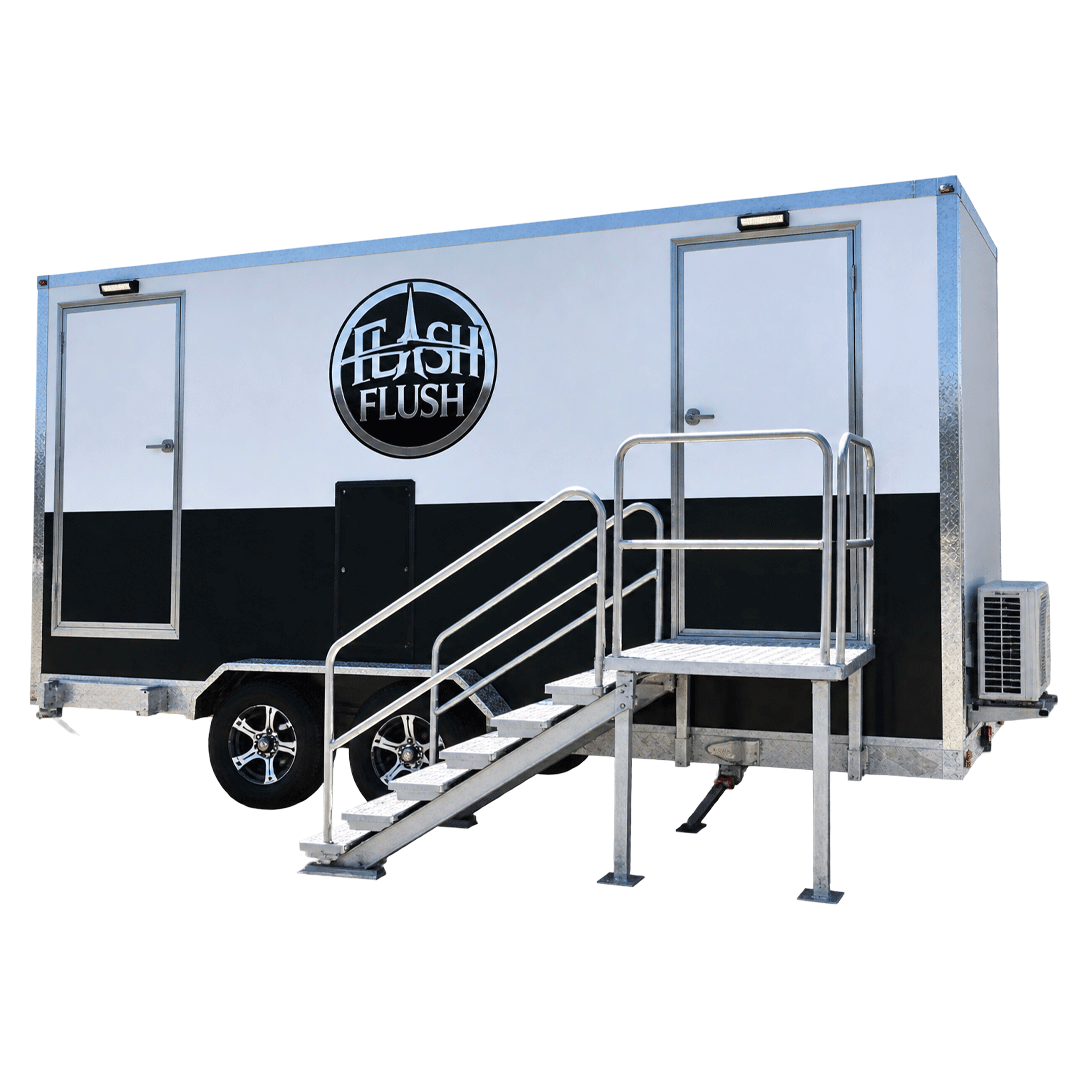 Black and silver mobile restroom trailer with stairs and railings, branded “Flush Flush”