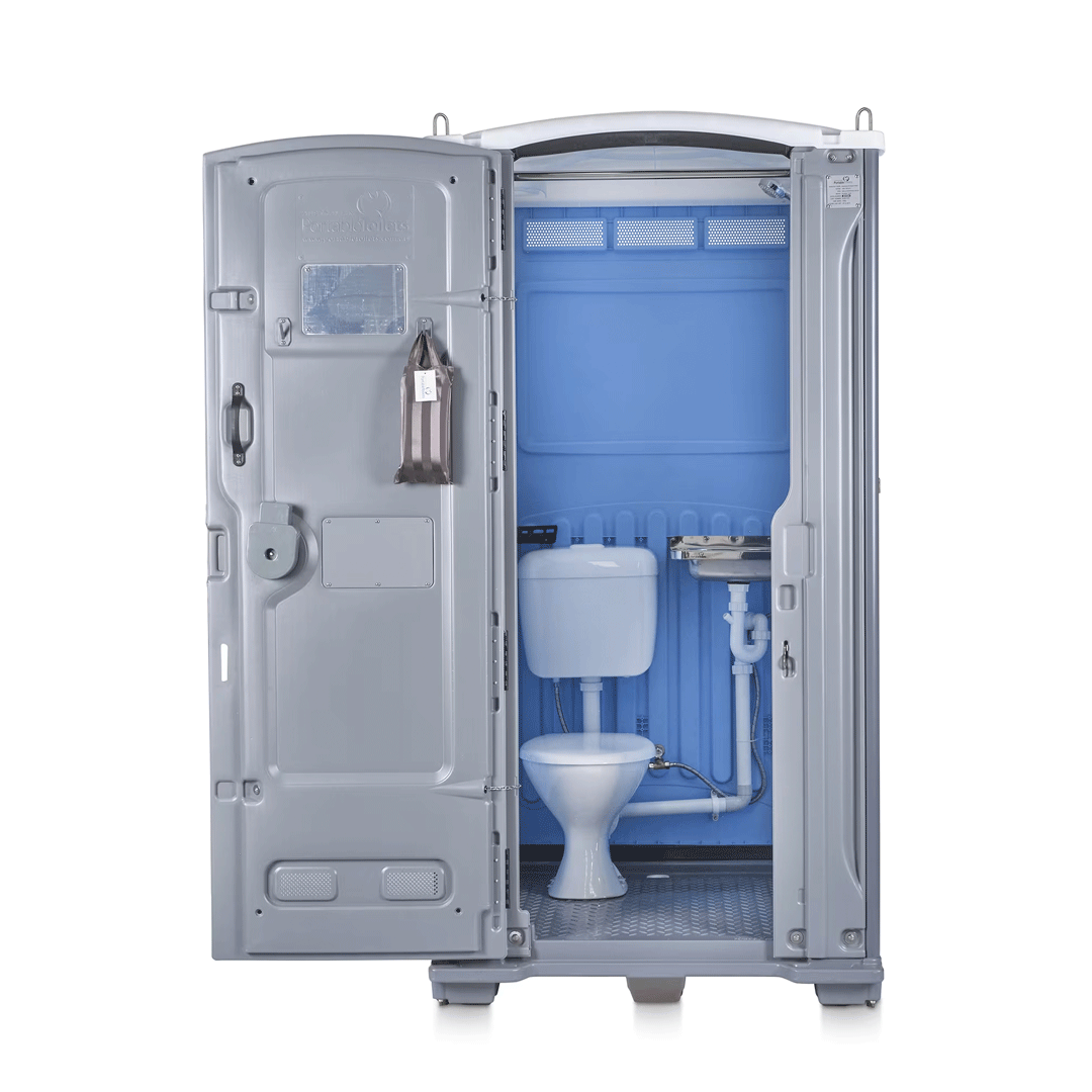 Open portable toilet with toilet, sink, and wall-mounted dispenser inside a gray unit