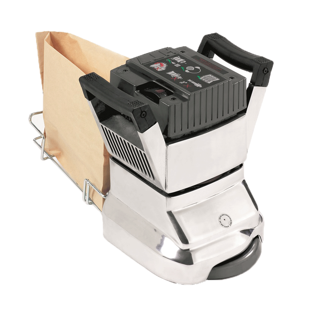 Small silver paper shredder with black top, shredding a brown paper bag