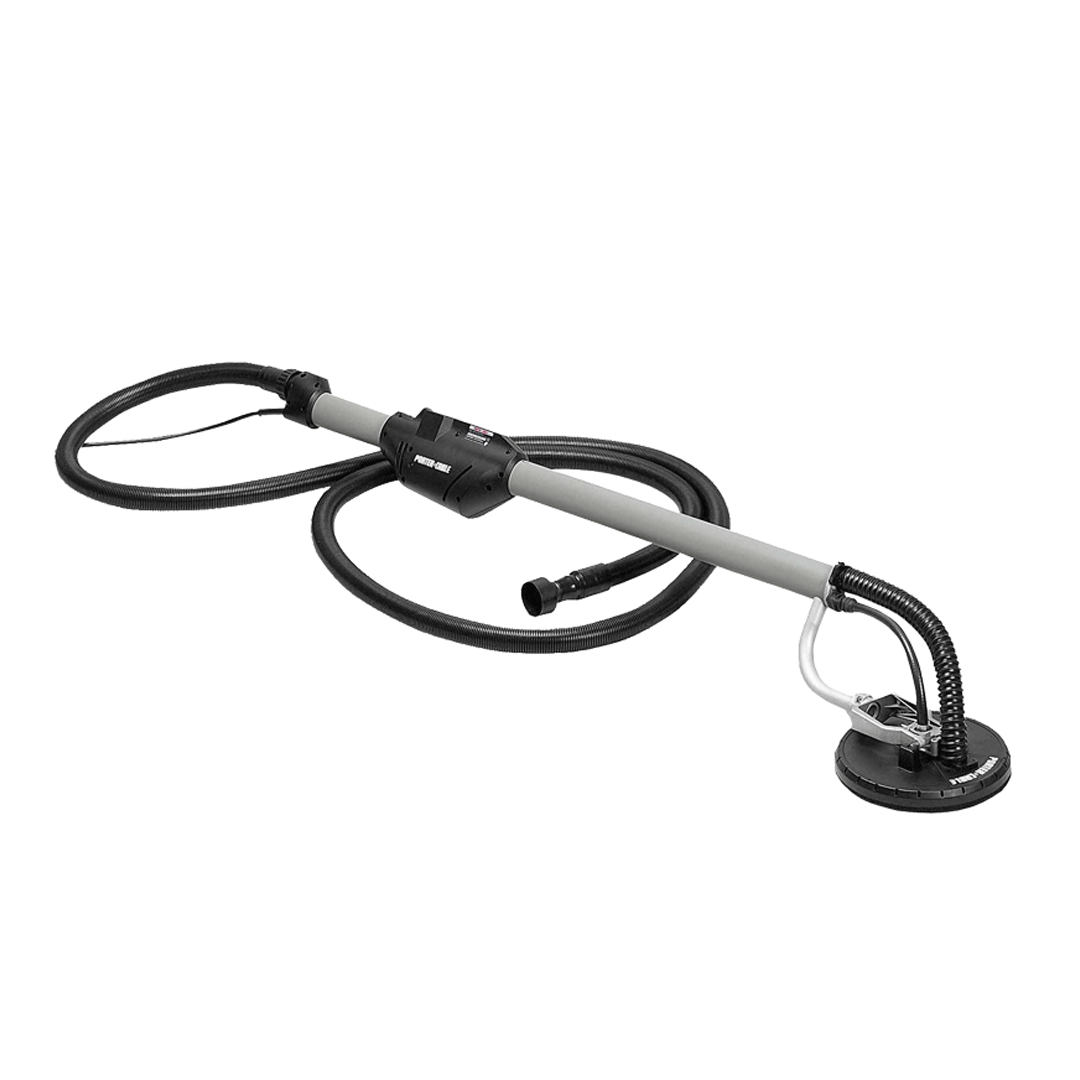 Black-and-silver vacuum hose with floor head and handle on white background