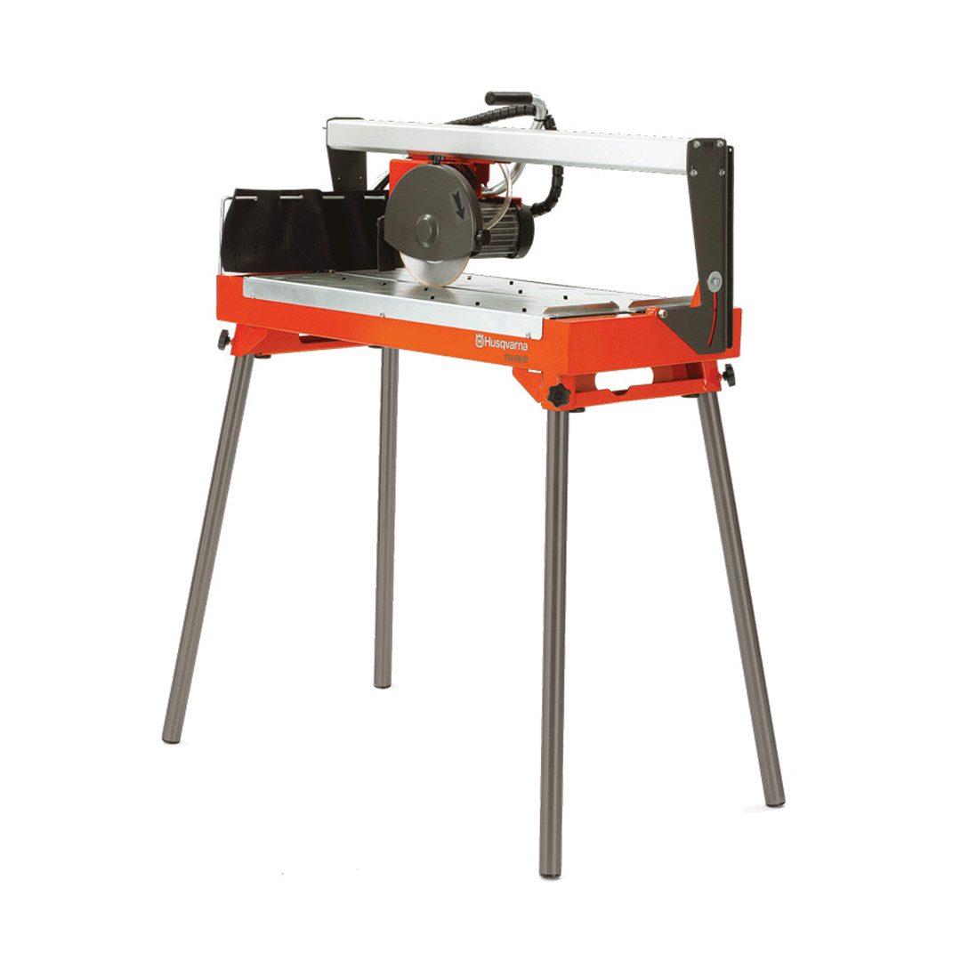 Portable orange tabletop tile saw on a metal stand, isolated on a white background