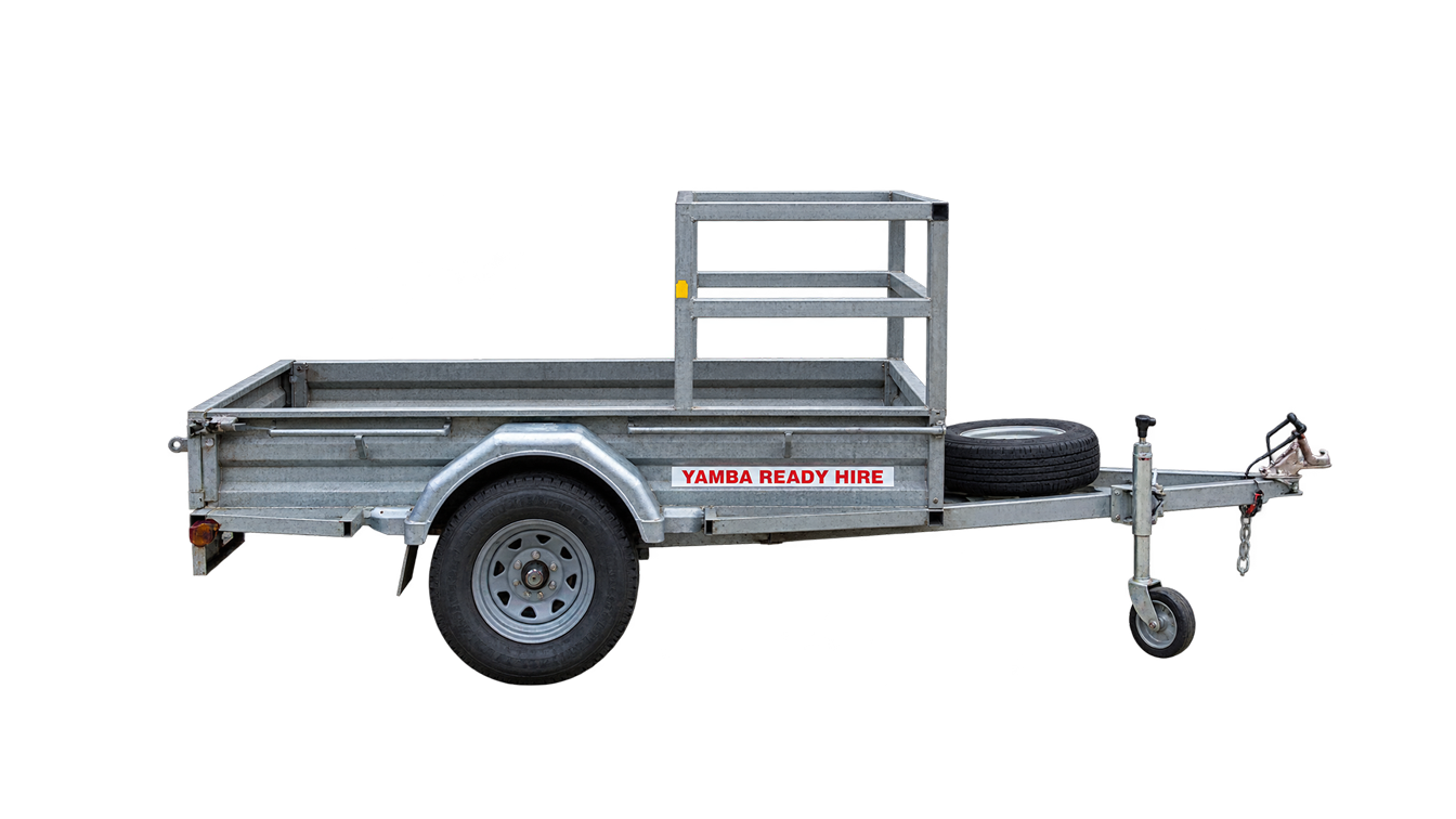 Small silver utility trailer with side rails, single wheel, and front jack stand on a white background