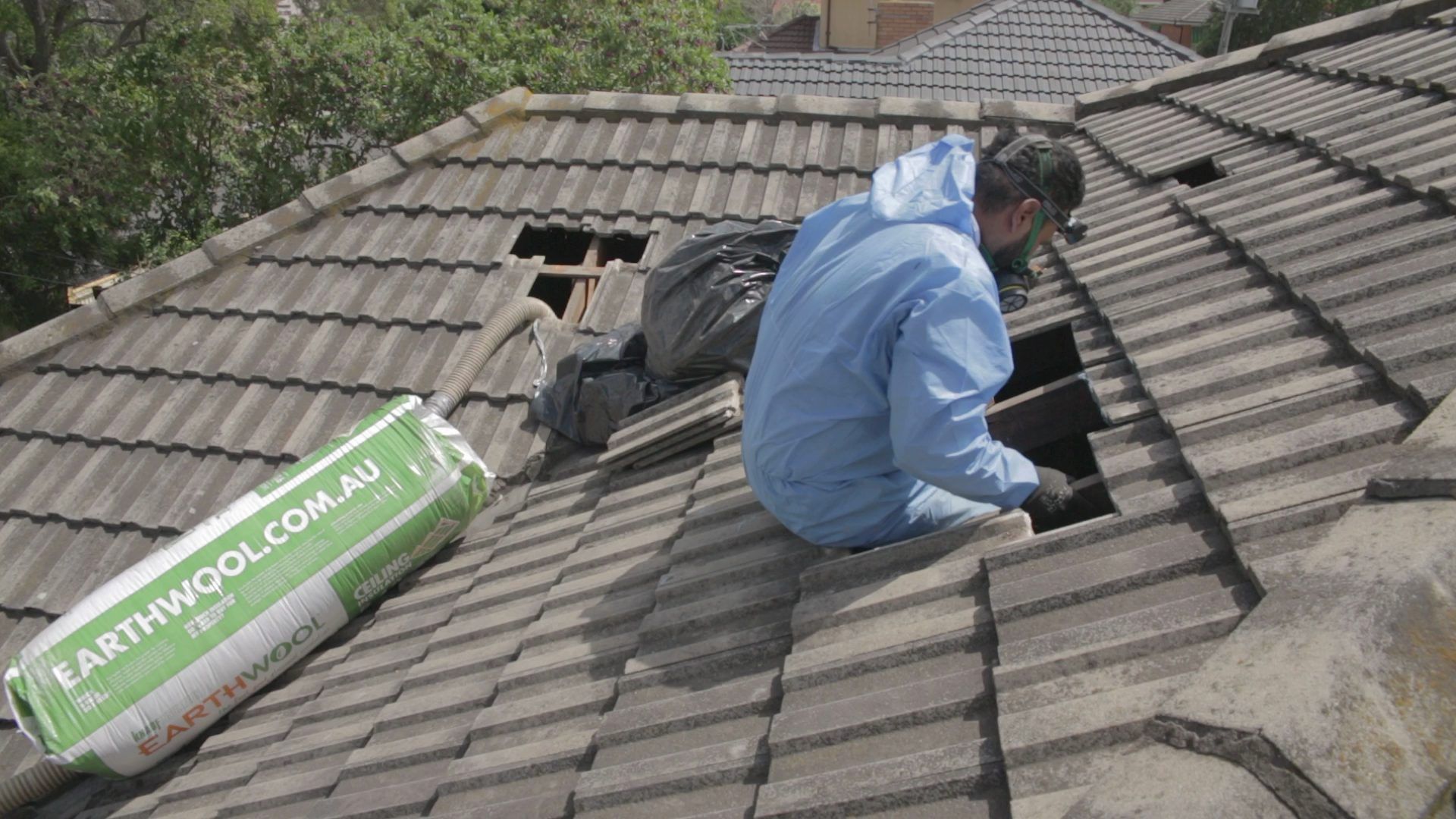 Ceiling Alert technician installing ceiling insulation through the roof