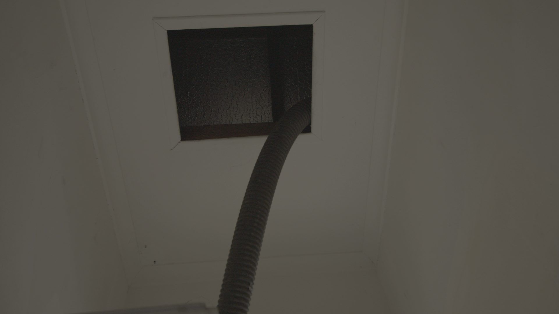 Clean ceiling access hatch after dust extraction, no mess inside the home
