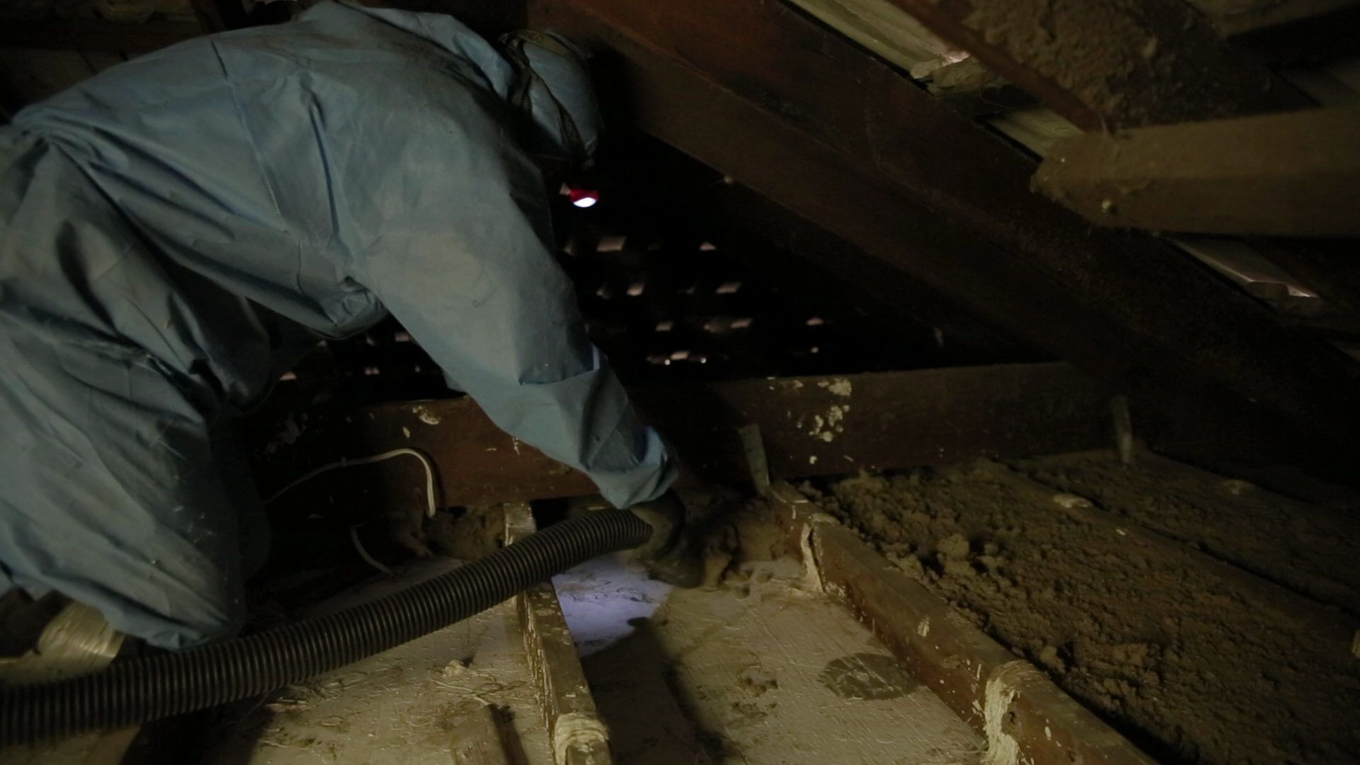Roof cavity vacuumed clean before new insulation is installed