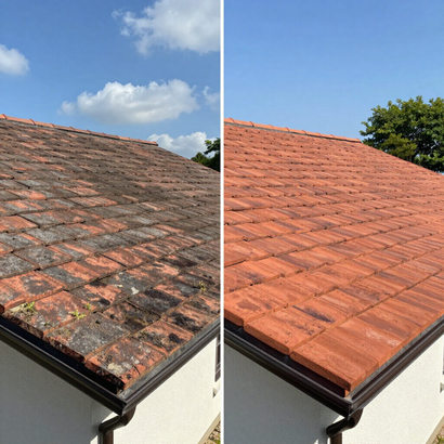 Before-and-after of a roof cleaning: stained dark tiles on the left, cleaned red tiles on the right.