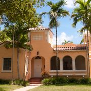 A house with palm trees — Windemere, FL — Valor Homes Construction LLC A house with palm trees — Windemere, FL — Valor Homes Construction LLC