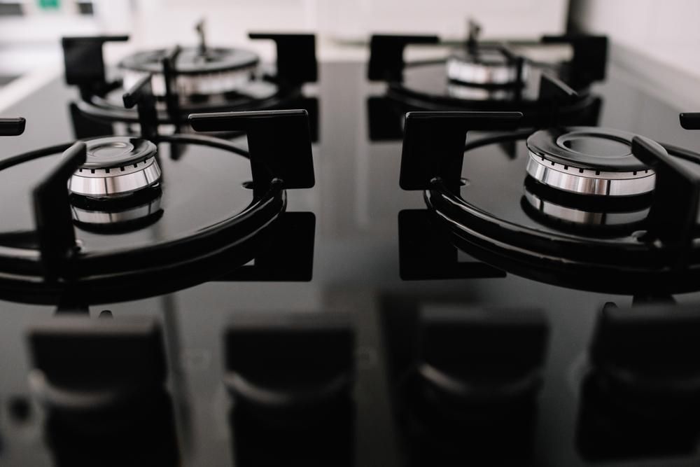 Close-up of a Black Stovetop With Four Burners — David McNeill Plumma (Gas Specialist) In Cessnock, NSW