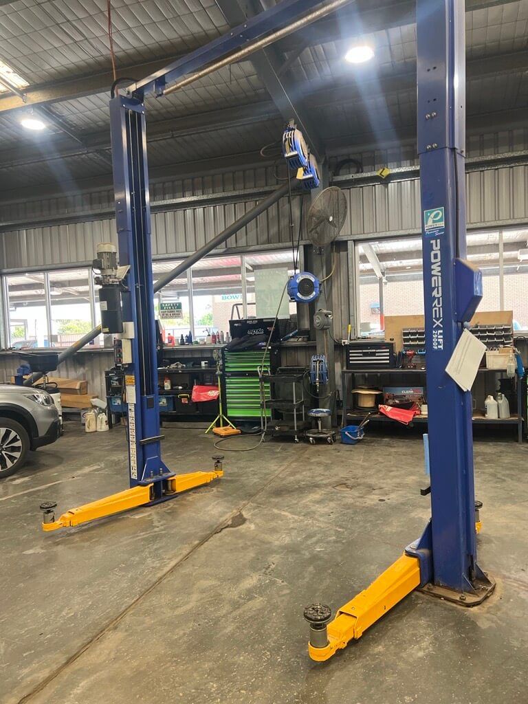Blue Powerrex Hoist With Yellow Stands in Mechanic Workshop — Hoist in Dubbo