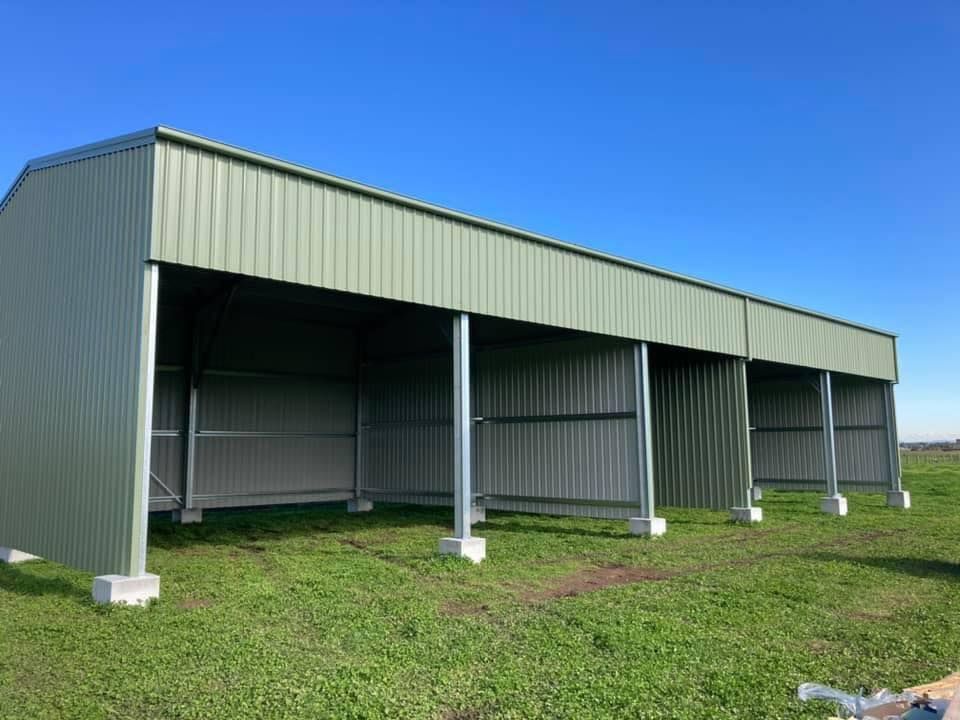 Green Metal Agricultural Shed with Open Sides and A Clear Blue Sky — Fair Dinkum Builds Port Stephens in Bobs Farm, NSW