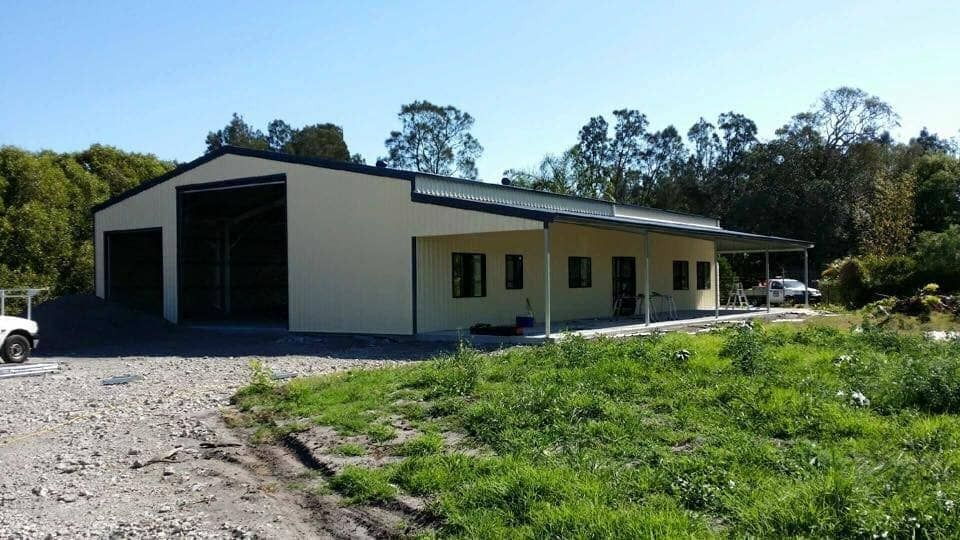 Light Tan and Dark-Roofed Industrial Building with Open Garage Bays — Fair Dinkum Builds Port Stephens in Bobs Farm, NSW