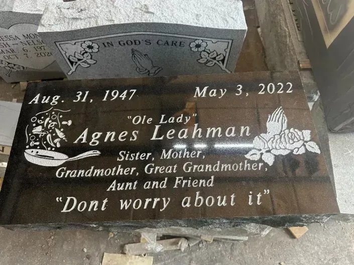 Gravestone with flowers and inscriptions for Agnes Lehman, dated Aug. 31, 1947 and May 3, 2022