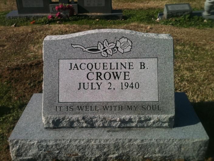 Gravestone for Jacqueline B. Crowe with flowers carved at top and the inscription “It is well with my soul.”