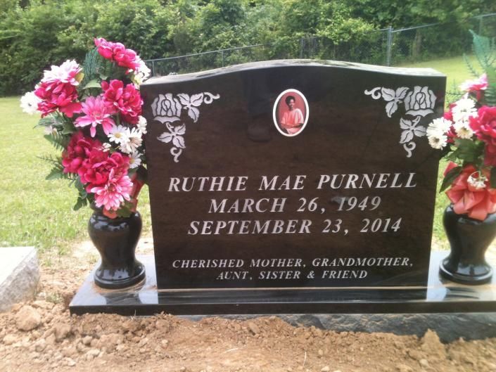 Gravestone with pink flowers, commemorating Ruthie Mae Purnell, March 26, 1949–September 23, 2014.