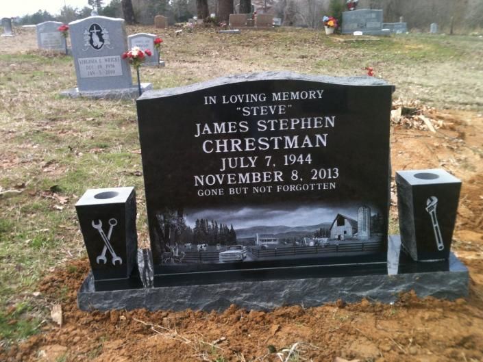 Black memorial gravestone with white lettering in a cemetery, honoring Steve James Stephen Chrestman (1967–2014).