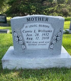 Gray gravestone in a cemetery engraved “MOTHER” and memorial text for Carrie L. Williams, 1932–2018