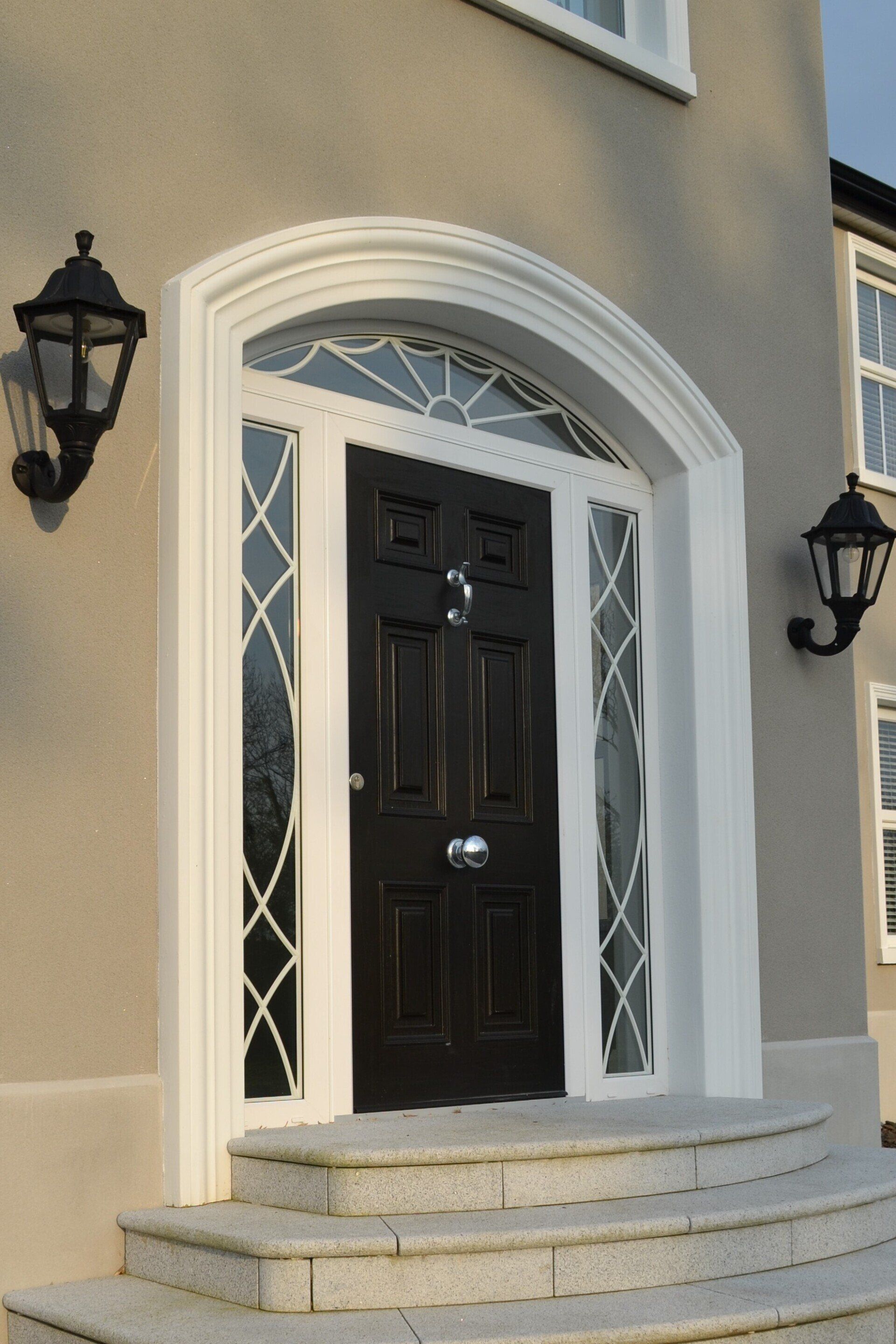 A house with a black door and white trim
