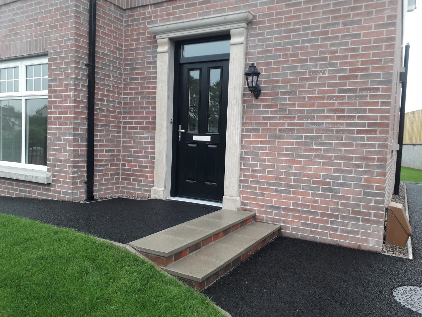 A close up of a door with a white molding on it.