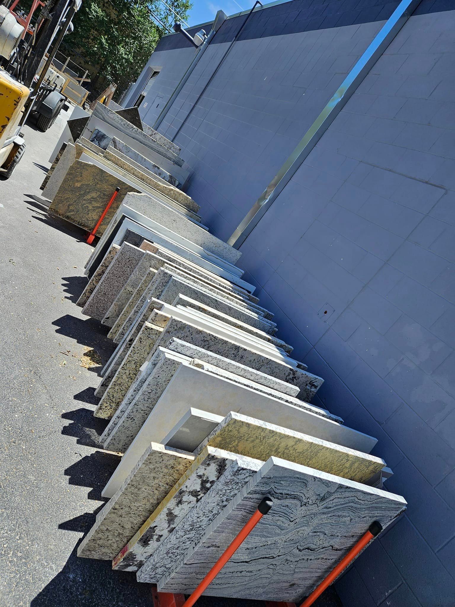 A bunch of marble slabs are stacked on top of each other on a cart.