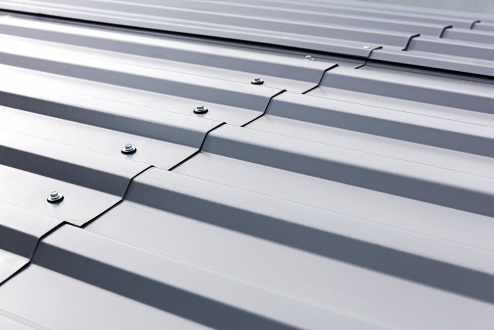 Close-up of a Silver Metal Roof With Ridged Panels Joined — Townsville Stainless Steel in Cooktown, QLD